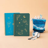 Tsuki Ocean Edition Ring Bound notebooks in aqua blue and deep teal with Ocean washi tape and Ocean edition pop up standing pencil case in ocean blue in peach background