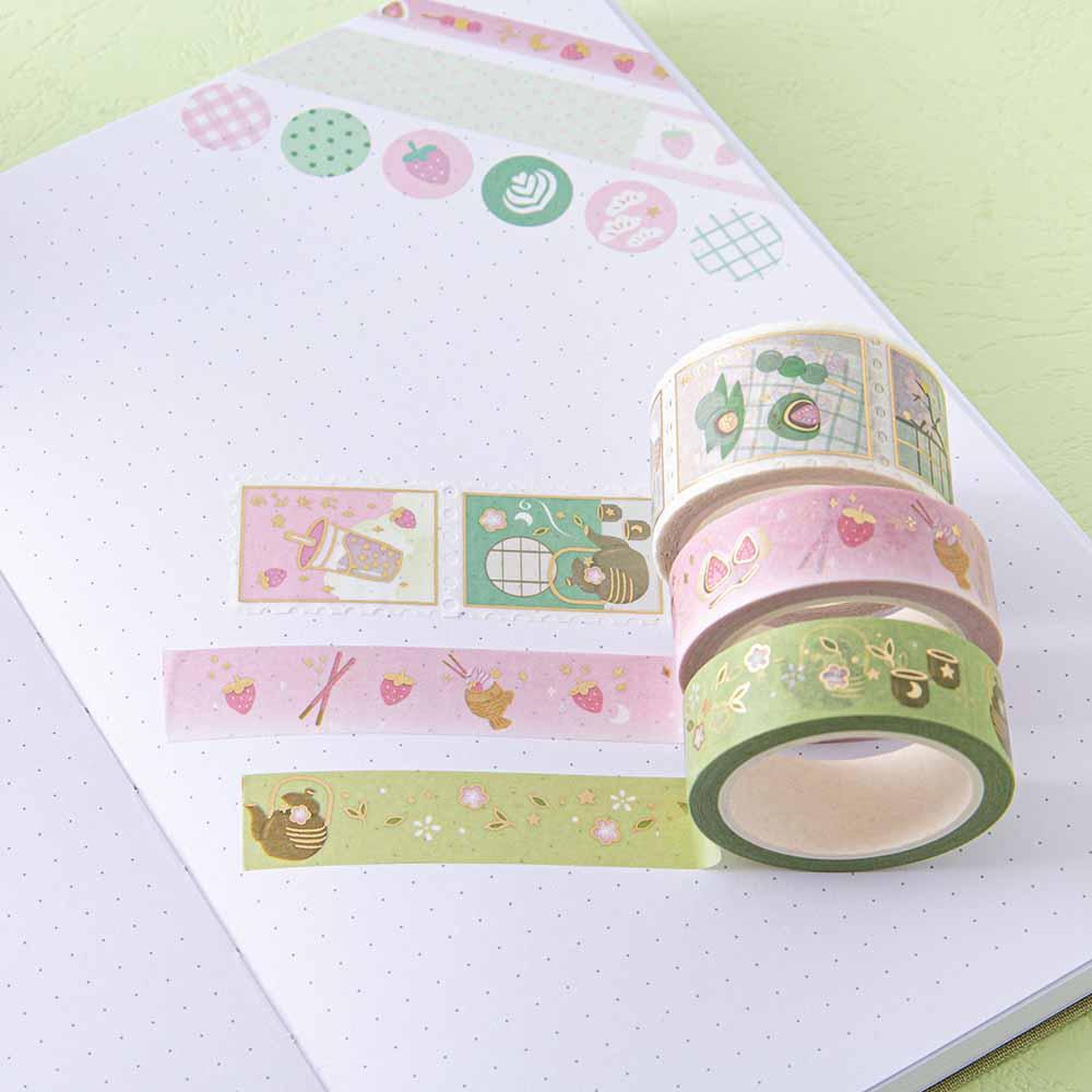Close up of Tsuki ‘Matcha Ichigo’ Washi Tape Set on Tsuki ‘Matcha Matcha’ Limited Edition bullet journal pages with teacup on matcha green background