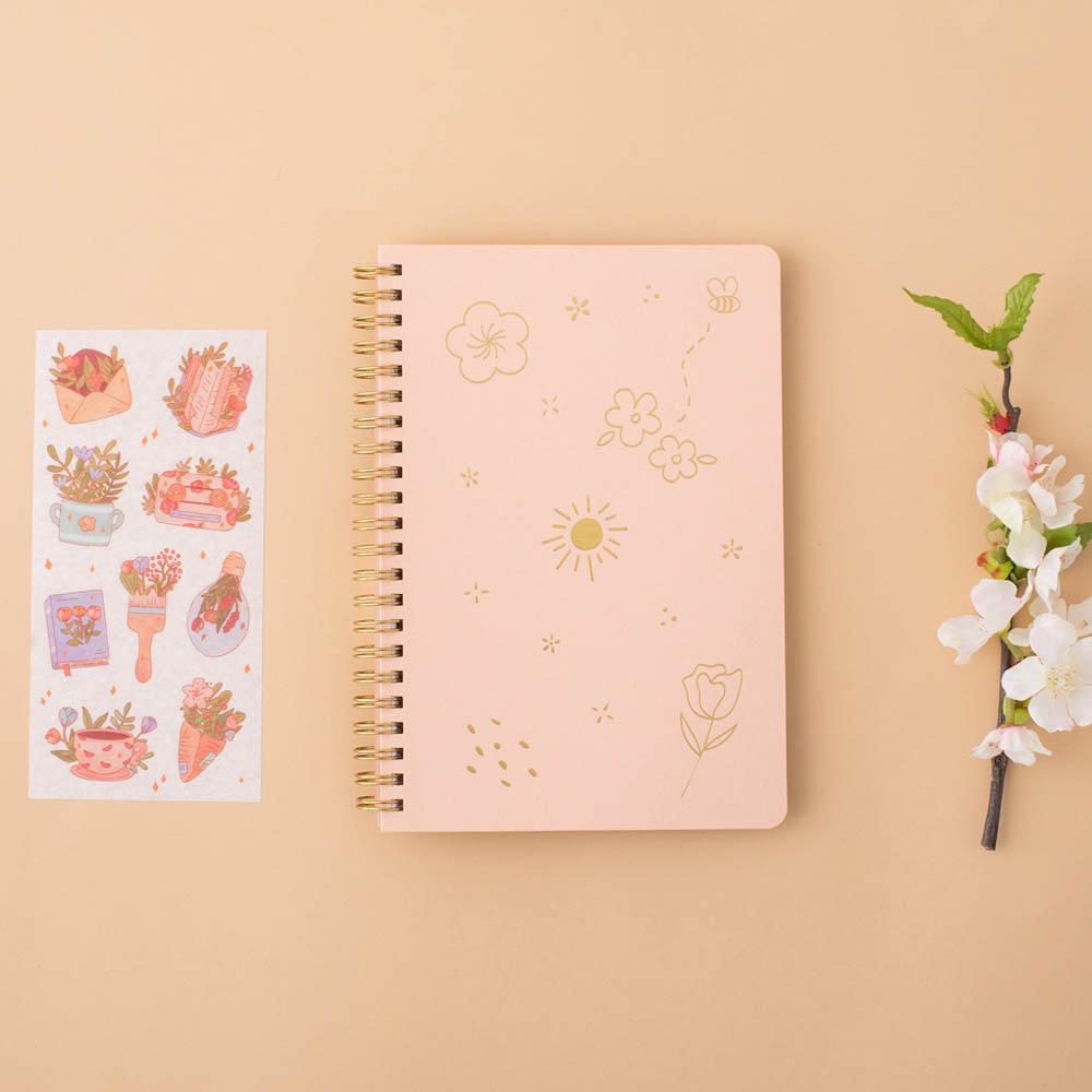 Honey Peach Tsuki Floral ringbound bullet journal with free sticker sheet on peach background