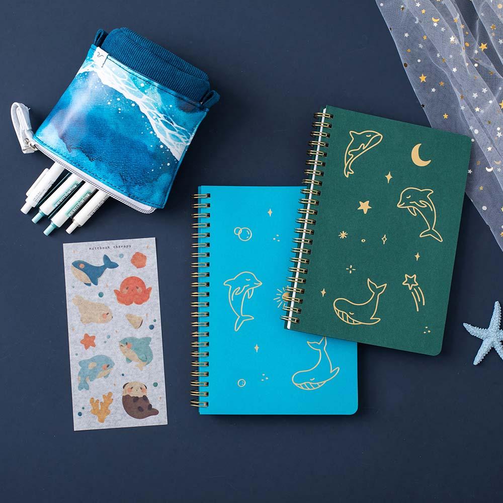 Tsuki Ocean Edition Ring Bound notebooks in deep teal with free sticker sheet and Ocean washi tape and starfish on dark blue background