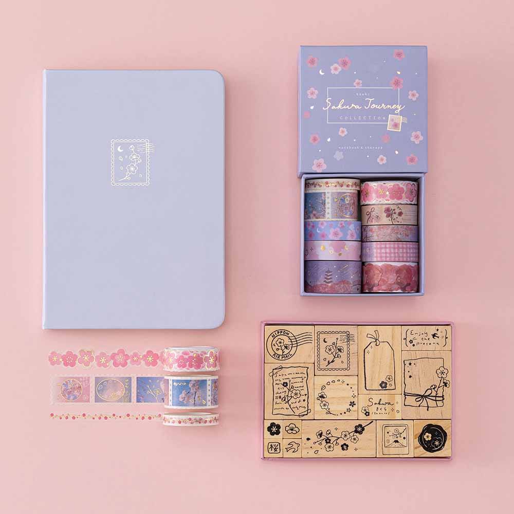 Tsuki ‘Sakura Journey’ Washi Tape Set with Tsuki ‘Sakura Journey’ Bullet Journal Stamp Set and Tsuki ‘Sakura Journey’ Limited Edition Bullet Journal on light pink background