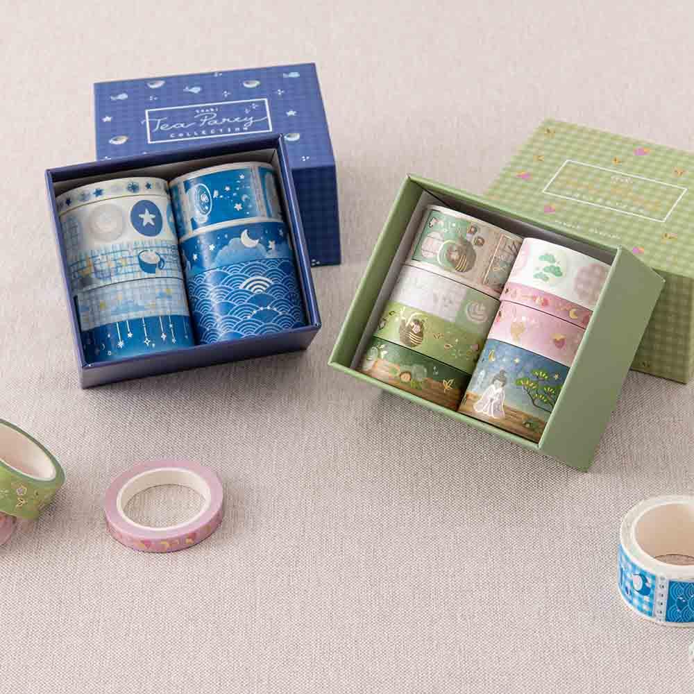 Tsuki ‘Cup of Galaxy’ Washi Tape Set and Tsuki ‘Matcha Ichigo’ Washi Tape Set on linen covered table