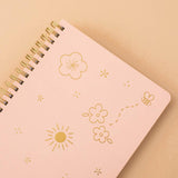 Close up on honey peach cover Tsuki ringbound notebook on peach background