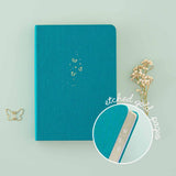 Tsuki Teal Sky ‘Flutter + Dream’ Limited Edition Bullet Journal by Notebook Therapy x Pelinkan with etched gold pages and free butterfly bookmark gift with dried flowers on mint background