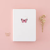 Tsuki Cloud White ‘Flutter + Dream’ Limited Edition Bullet Journal by Notebook Therapy x Pelinkan with free butterfly bookmark gift with dried flowers in pastel pink background