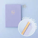 Tsuki ‘Full Bloom’ Limited Edition Bullet Journal with gold etched page edges and free gift on lilac background