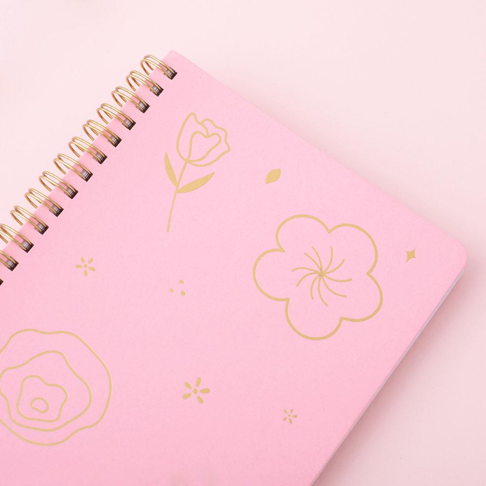 Close up on sakura pink cover Tsuki ringbound notebook on pink background