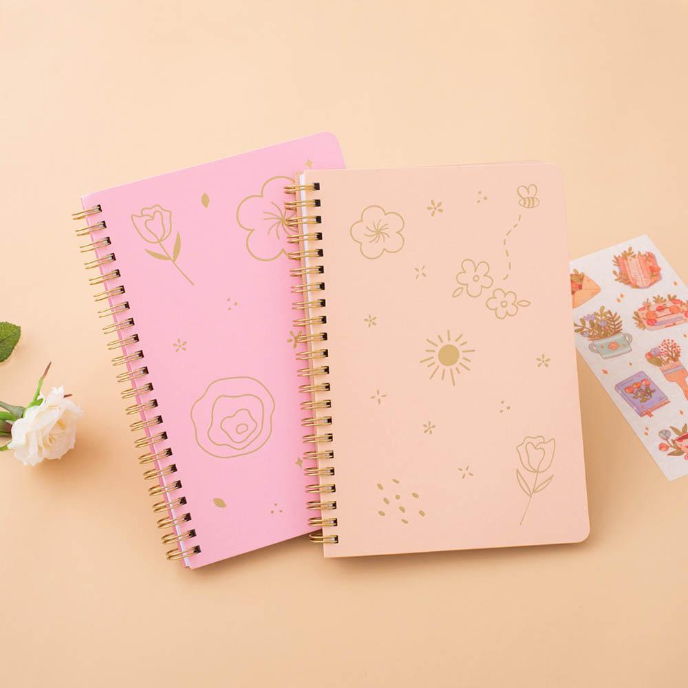Sakura Pink and honey Peach Tsuki Floral ringbound bullet journal with free sticker sheet on peach background