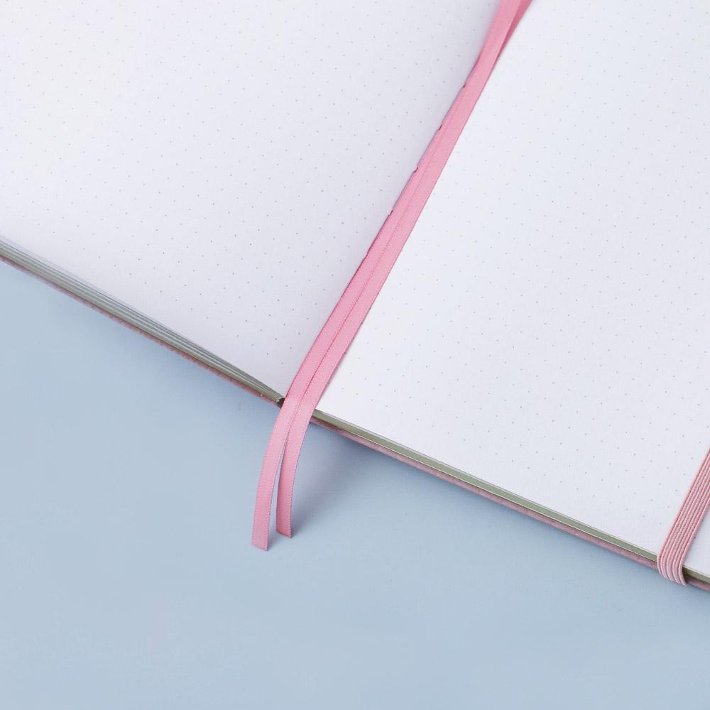 Open Tsuki 'Sakura' Limited Edition Bullet Journal with two pink bookmark ribbons on light pink background