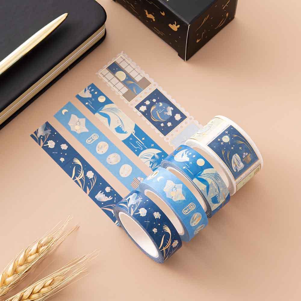 Tsuki ‘Moonlit Wish’ Washi Tape Set with wheat reeds and Tsuki ‘Moonlit Wish’ Limited Edition Bullet Journal with gold pen on light brown background