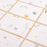 Close up of Tsuki Handmade Petal Paper Pack on beige background