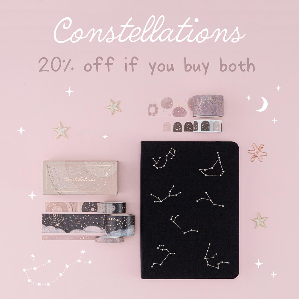 Flatlay of black constellations bullet journal and washi tape set with the words “constellations 20% off if you buy both” 
