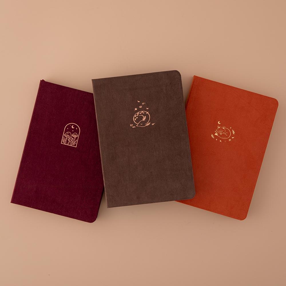 Tsuki Kraft Paper Limited Edition Bullet Journals in Kitsune and Kinoko and Nara on beige background