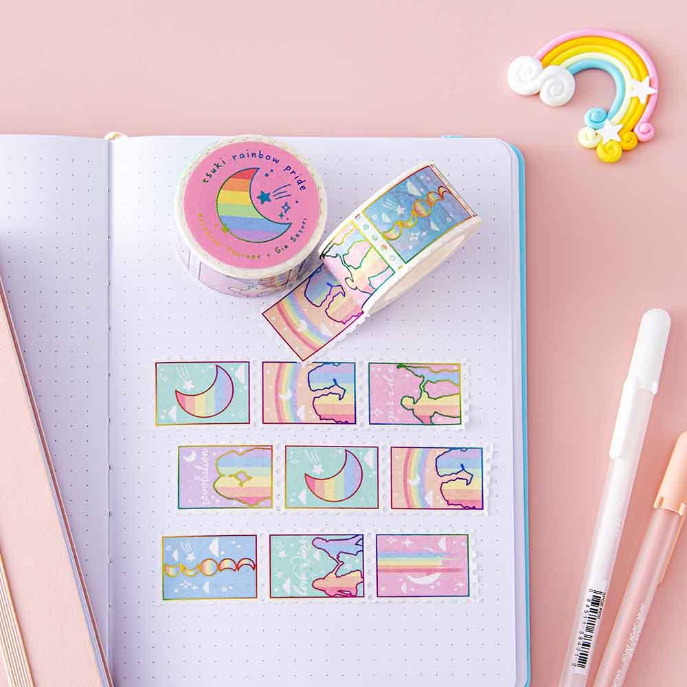 Tsuki Rainbow Pride Washi Tape on open Tsuki Pastel Edition bullet journal page with pens and rainbow on light pink background