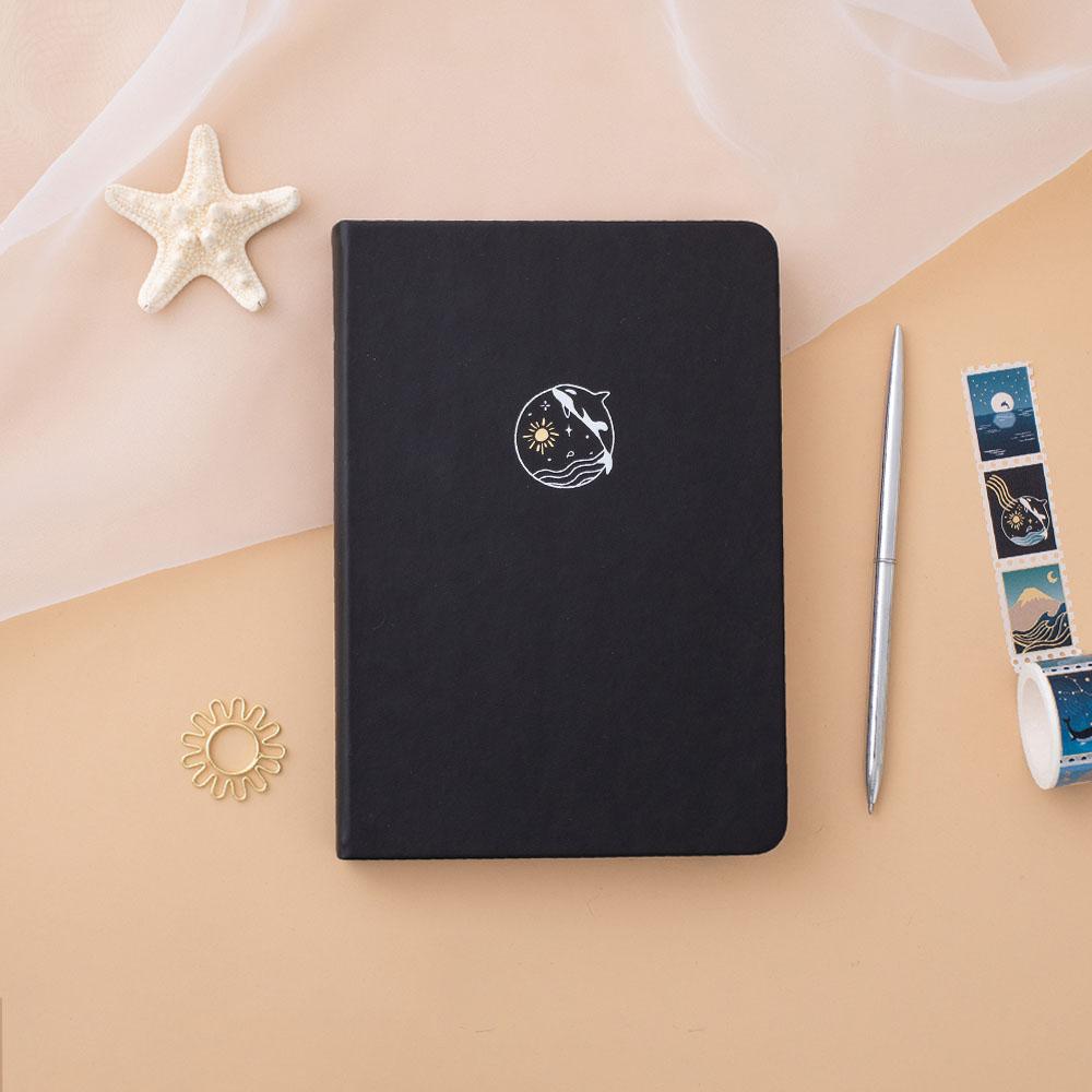 Tsuki deep black Playful Orca limited edition notebook with starfish and silver pen and Tsuki Ocean Collection Washi Tape with free sunshine gift on peach background