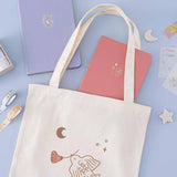 Tsuki ‘Moonflower’ Limited Edition Tote Bag with ‘Suzume’ Limited Edition Bullet Journal and ‘Full Bloom’ Limited Edition Notebook and ‘Moonflower’ Washi Tape Set with free stickers with star and moon on light blue background