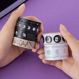 Tsuki ‘Moonlit Spell’ Washi Tapes held in hands in purple background