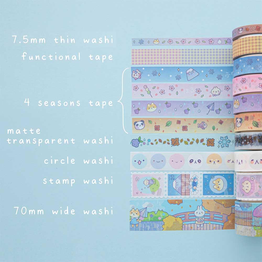 Tsuki ‘Four Seasons’ Washi Tape Set by Notebook Therapy x Milkkoyo rolled out in various sizes on light blue background