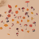 Tsuki Mixed Scrapbook Paper Pack free mushroom and autumn leaf stickers on beige background