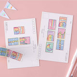Tsuki Rainbow Pride Washi Tape on postcards with pens and bunting on light pink background