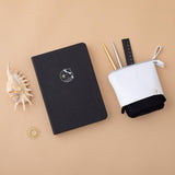 Tsuki deep black Playful Orca limited edition notebook with seashells and Tsuki pop-up pencil case with free sunshine gift on peach background