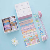 Tsuki ‘Four Seasons’ Washi Tape Set by Notebook Therapy x Milkkoyo shown on white card with white flower on light blue background