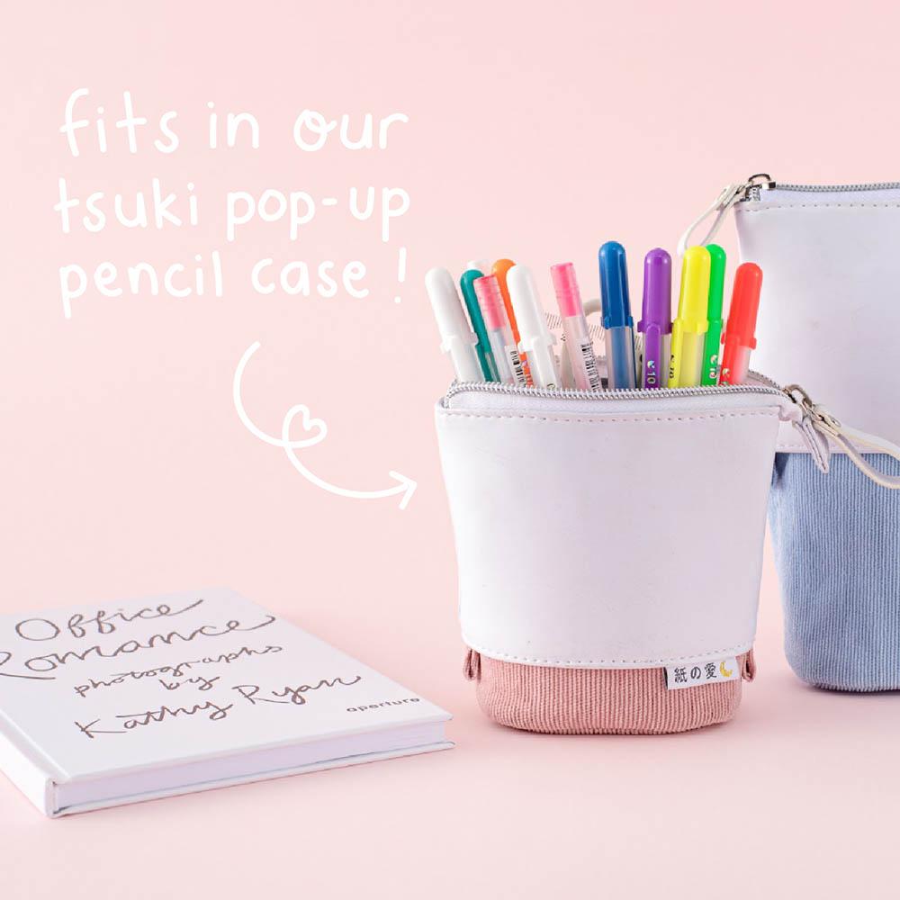 Gelly Roll Pens in Tsuki Pop Up Pencil Case in Pink Sakura and Bluebell with book in baby pink background
