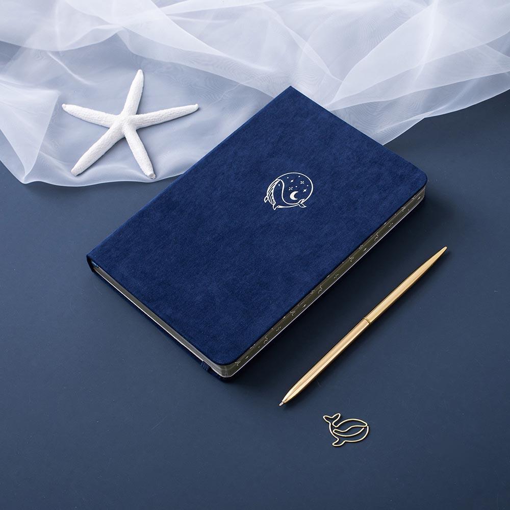 Tsuki deep blue textured vegan leather Gentle Giant luxury edition notebook with gold pen and starfish and free whale gift on deep blue background