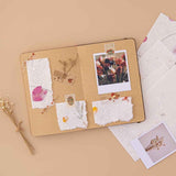 Tsuki Handmade Petal Paper Pack ripped and stuck onto open Tsuki Kraft Paper Limited Edition Bullet Journal with polaroid pictures and died flowers on beige background