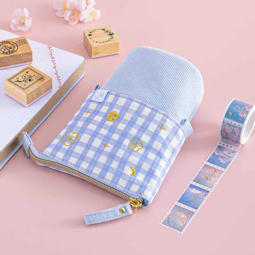 Tsuki ‘Sakura Journey’ Pop-Up Pencil Case with Tsuki ‘Sakura Journey’ Washi Tape and Tsuki ‘Sakura Journey’ Bullet Journal Stamps and Tsuki ‘Sakura Journey’ Limited Edition Bullet Journal with cherry blossoms on light pink backgrounds
