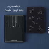 Tsuki Black Paper Limited Edition Hardcover Bullet Journal in Constellations with eco-friendly gift box in Falling Star on Navy background