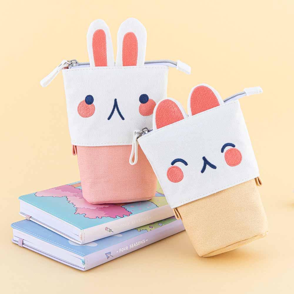 Tsuki ‘Four Seasons’ Embroidered Pop-Up Pencil Case by Notebook Therapy x Milkkoyo in kitty and bunny on Tsuki ‘Four Seasons: Spring Edition’ Bullet Journal and  Tsuki ‘Four Seasons: Summer Edition’ Bullet Journal in honey yellow background