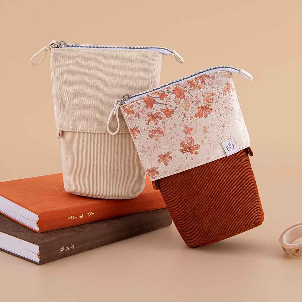 Tsuki ‘Maple Dreams’ Pop-Up Pencil cases in maple and stone with Tsuki ‘Kitsune’ Limited Edition Fox Bullet Journal and Tsuki ‘Nara’ Limited Edition notebook with Tsuki ‘Maple Dreams’ Washi Tape in beige background