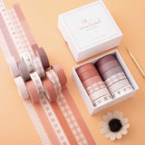 Tsuki Core Washi Tape Set in Warm Neutral with luxury eco-friendly gift box packaging and flowers at an angle on orange peach background
