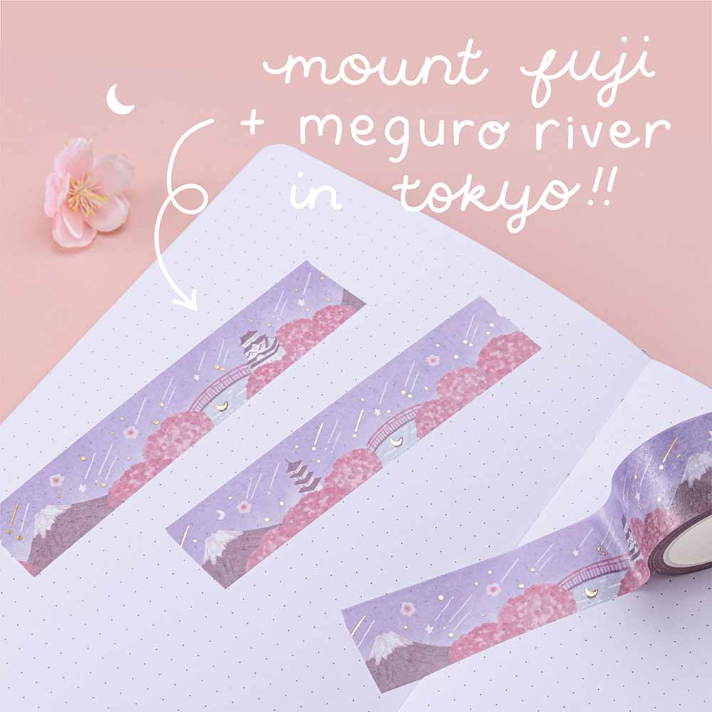 Close up of Tsuki ‘Sakura Journey’ Washi Tape with Mount Fuji and the Meguro River in Tokyo on open bullet journal page with cherry blossoms on light pink background