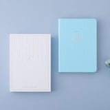 Tsuki Endless Summer Limited Edition Bullet Journal in Petal Blue with eco-friendly gift box packaging and white hydrangea flowers on light blue background