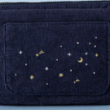 Close up of embroidered details on deep blue corduroy