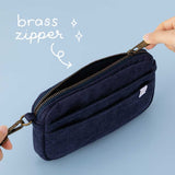 Close up of brass zipper on Tsuki ‘Cloud Dreamland’ travel pouch