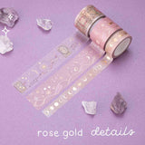Close up of Tsuki ‘Moonlit Blush’ Washi Tapes with rose gold details rolled out with amethyst stones on purple background