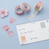 Tsuki 'Sakura Edition' Washi Tapes with postcard and sakura blooms on light blue background