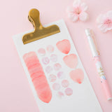 Tsuki 'Sakura Edition' Washi Sticker Tapes on white clipboard with sakura blooms and white pen on light pink background