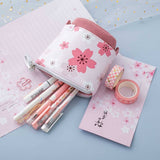 Tsuki 'Sakura Edition' Pop-Up Pencil Case in blush pink with pens inside with Tsuki 'Sakura Edition' Washi Tapes on sakura paper on sparkly netting on light blue background