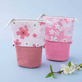 Tsuki 'Sakura Edition' Pop-Up Pencil Case in blush pink and petal pink with white flowers in light blue background