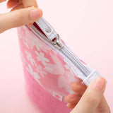 Tsuki 'Sakura Edition' Pop-Up Pencil Case in petal pink held in hands on light pink background