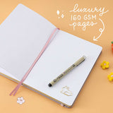 Open Tsuki Blush Pink ‘Bunny Blush’ Limited Edition Bullet Journal designed with Blossom Bujo with luxury 160GSM pages with free bunny bookmark with pen and felt flowers on apricot background
