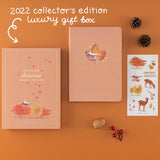 Flatlay of Tsuki Four Seasons: Autumn Collector’s Edition 2022 Bullet Journal with the text “2022 collectors edition luxury gift box in white
