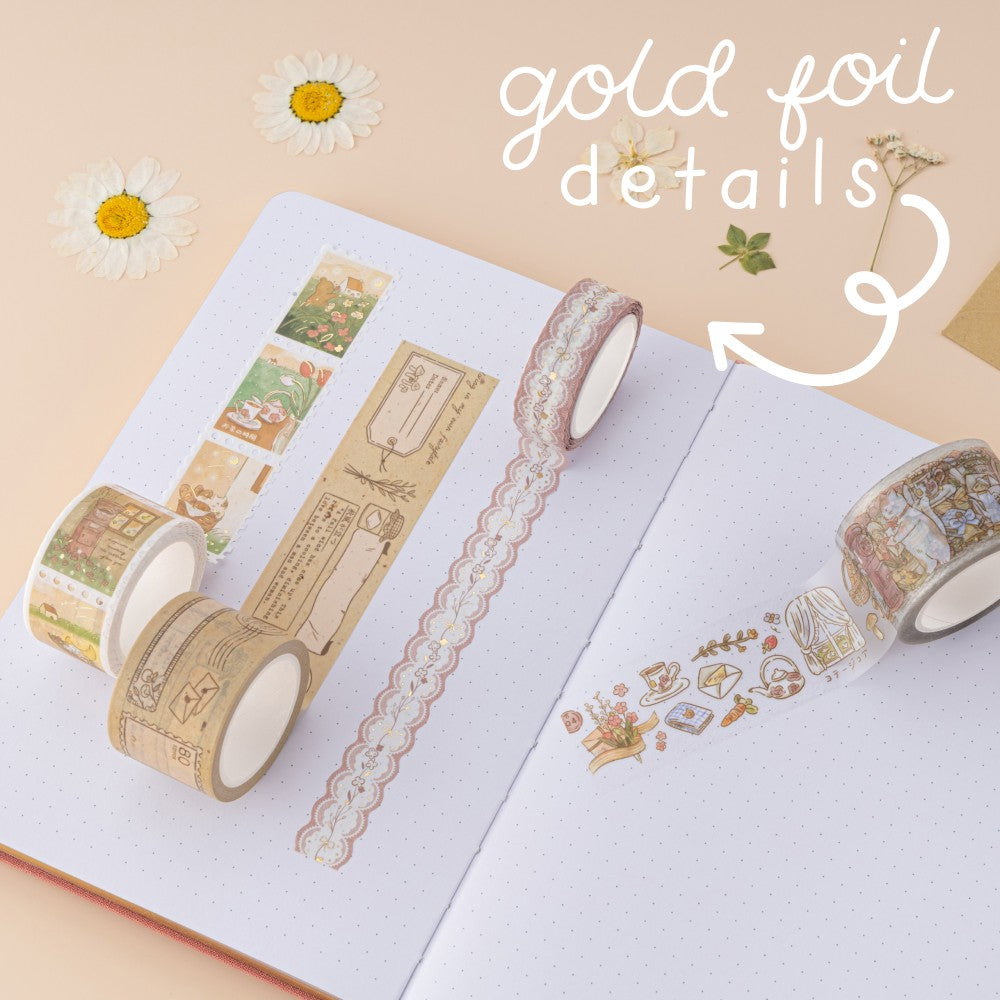 Gold foil details on washi tape on white bullet journal