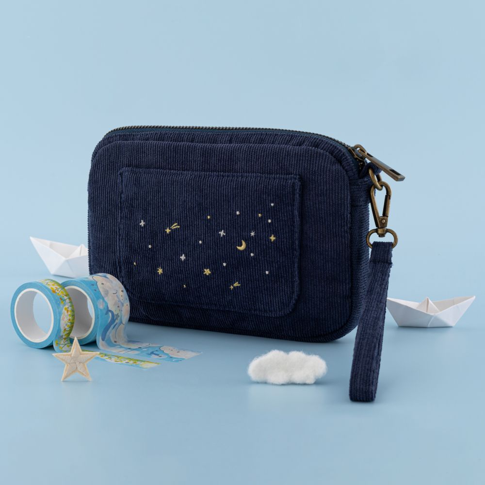 Tsuki ‘Cloud Dreamland’ Travel Pouch with washi tapes and a paperboat, some cloud decorations in sky blue background