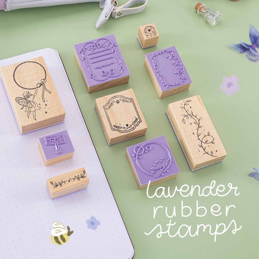 Tsuki ‘Enchanted Garden’ Stamp Set with lavender rubber and sage green background with purple flower decoration