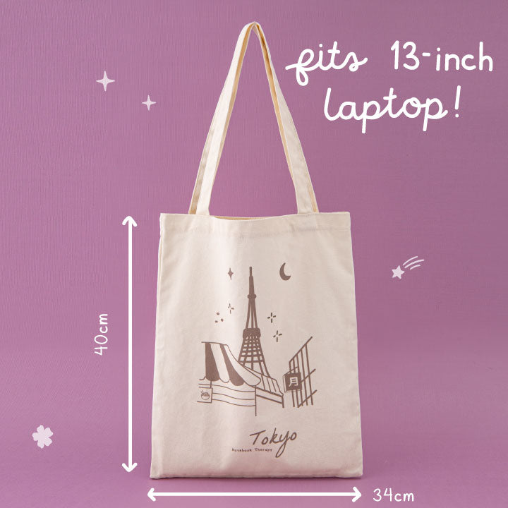 Tokyo tote bag in pink background with its measurements written in white